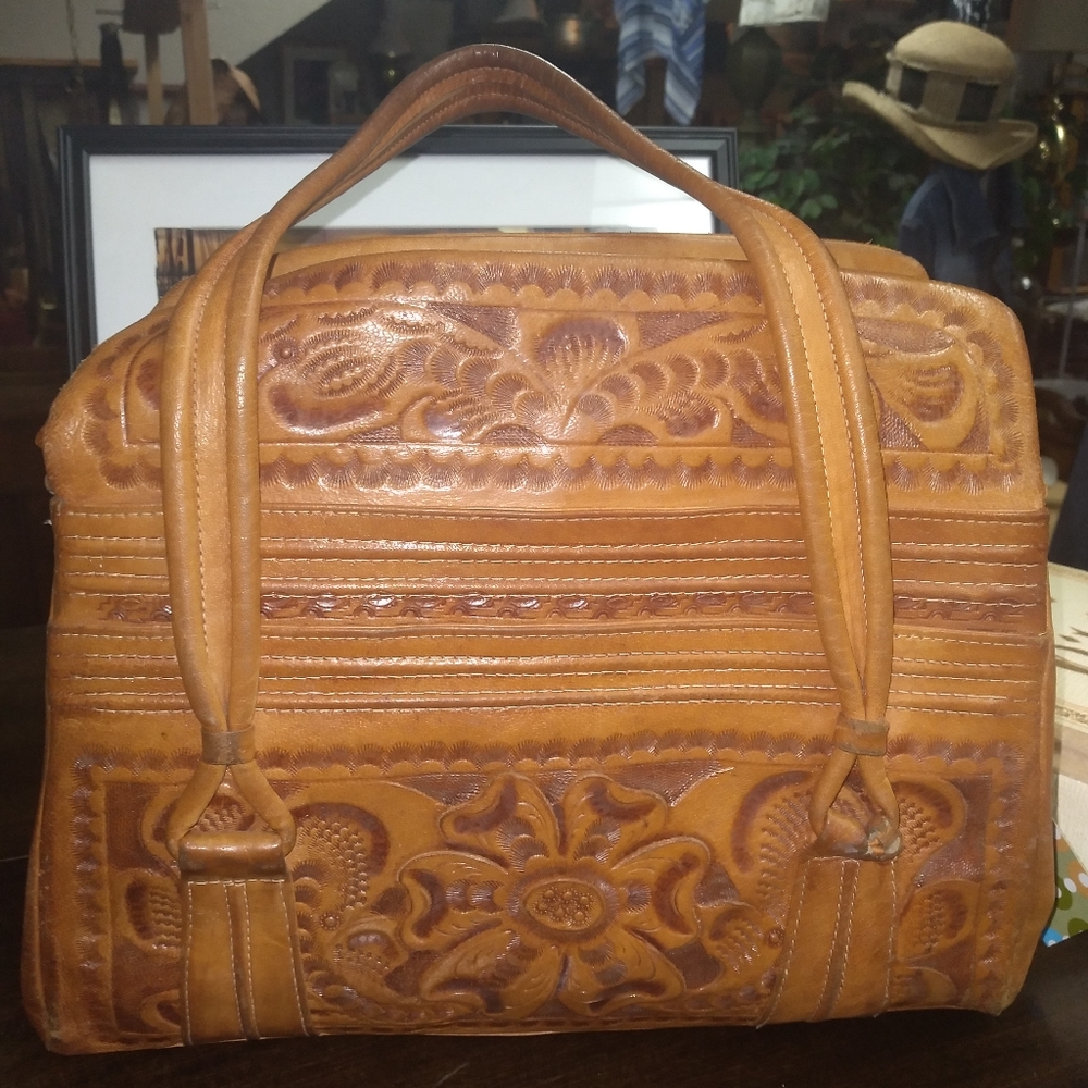 Vintage tooled leather bag. By Flores Bags